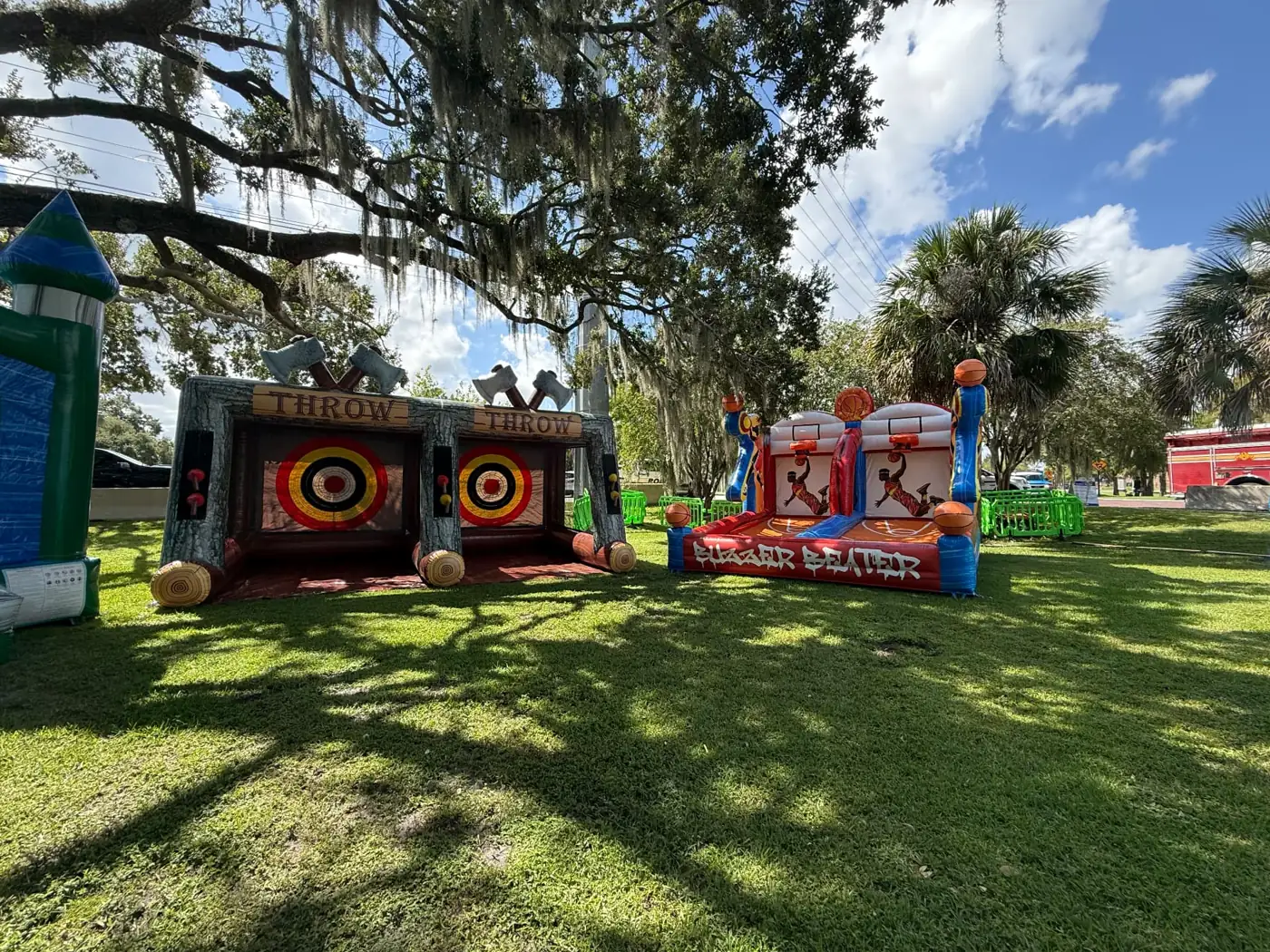 Inflatable target and basketball games set up together on grass