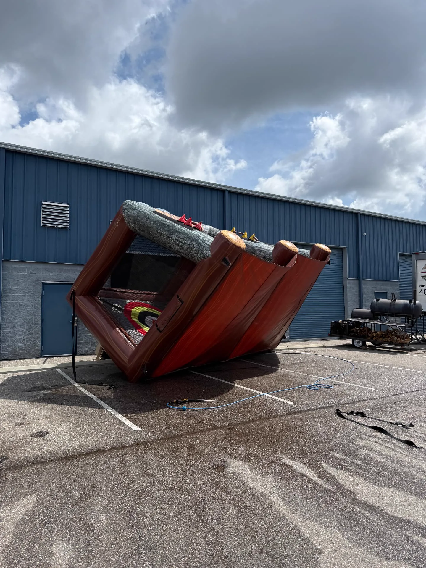 An inflatable being opened up and inspected during our cleaning process