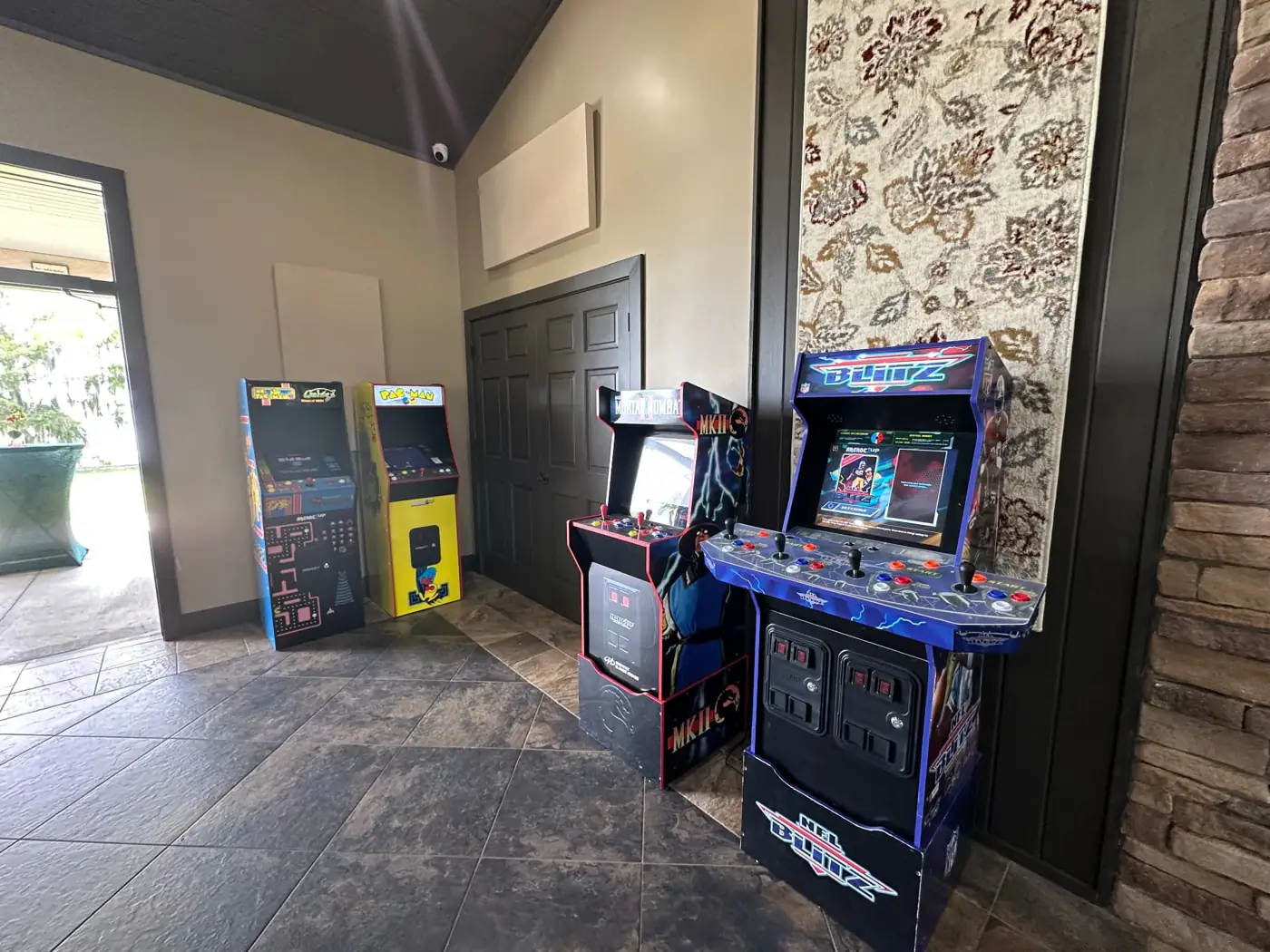 Arcade game cabinets arranged inside an event venue
