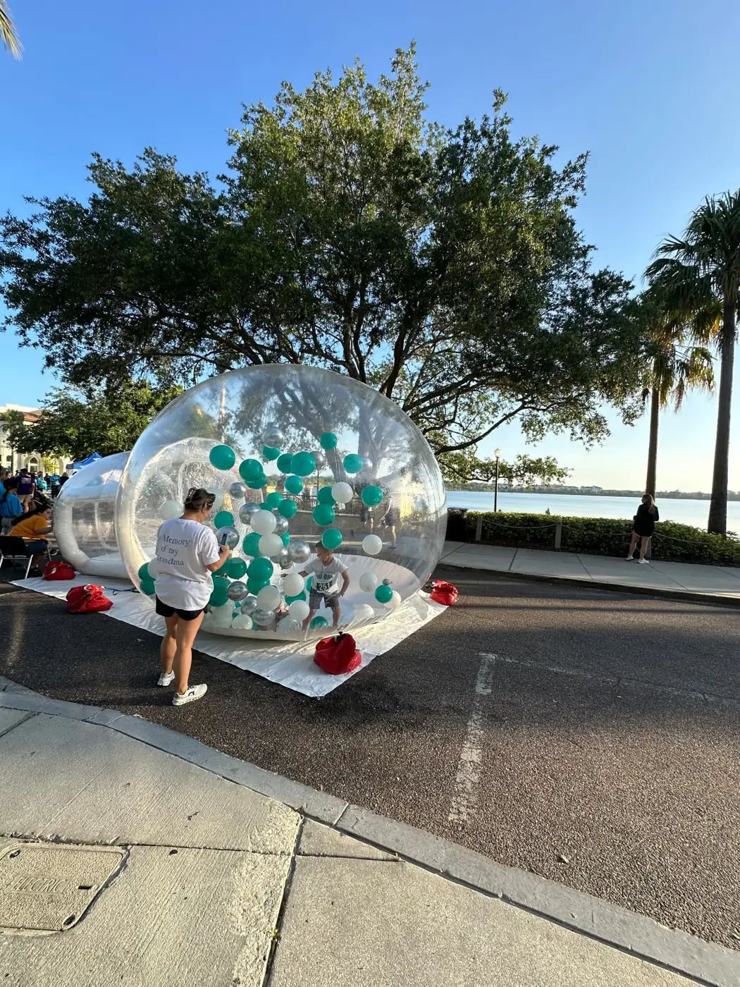 Transparent inflatable rolling ball displayed outdoors