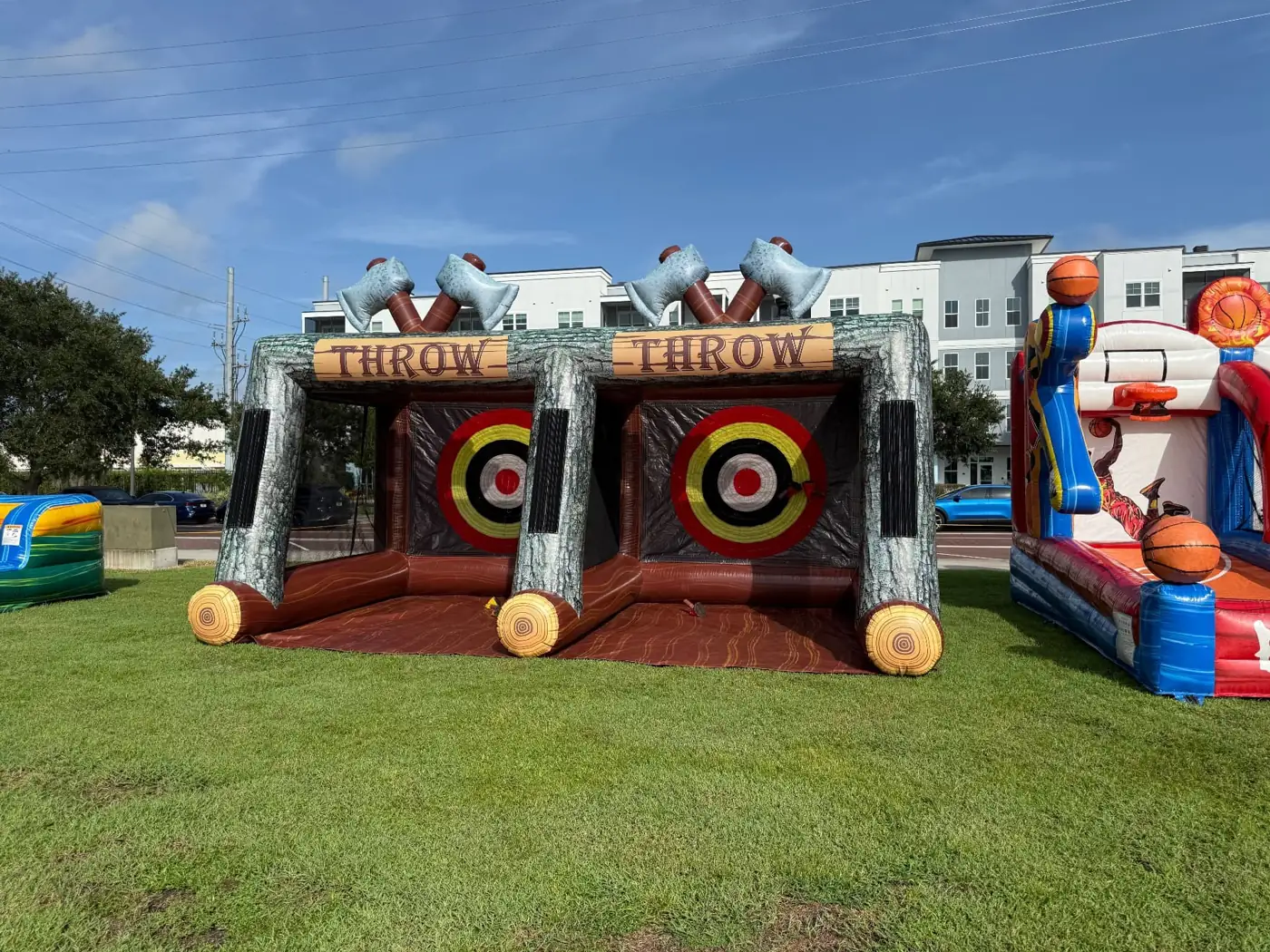 MJT inflatable axe throwing and basketball games at an outdoor event