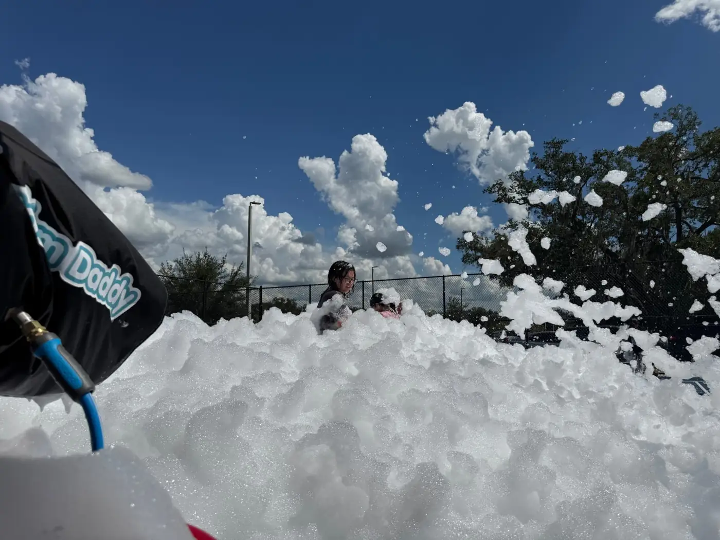 MJT foam cannon filling an outdoor party with foam